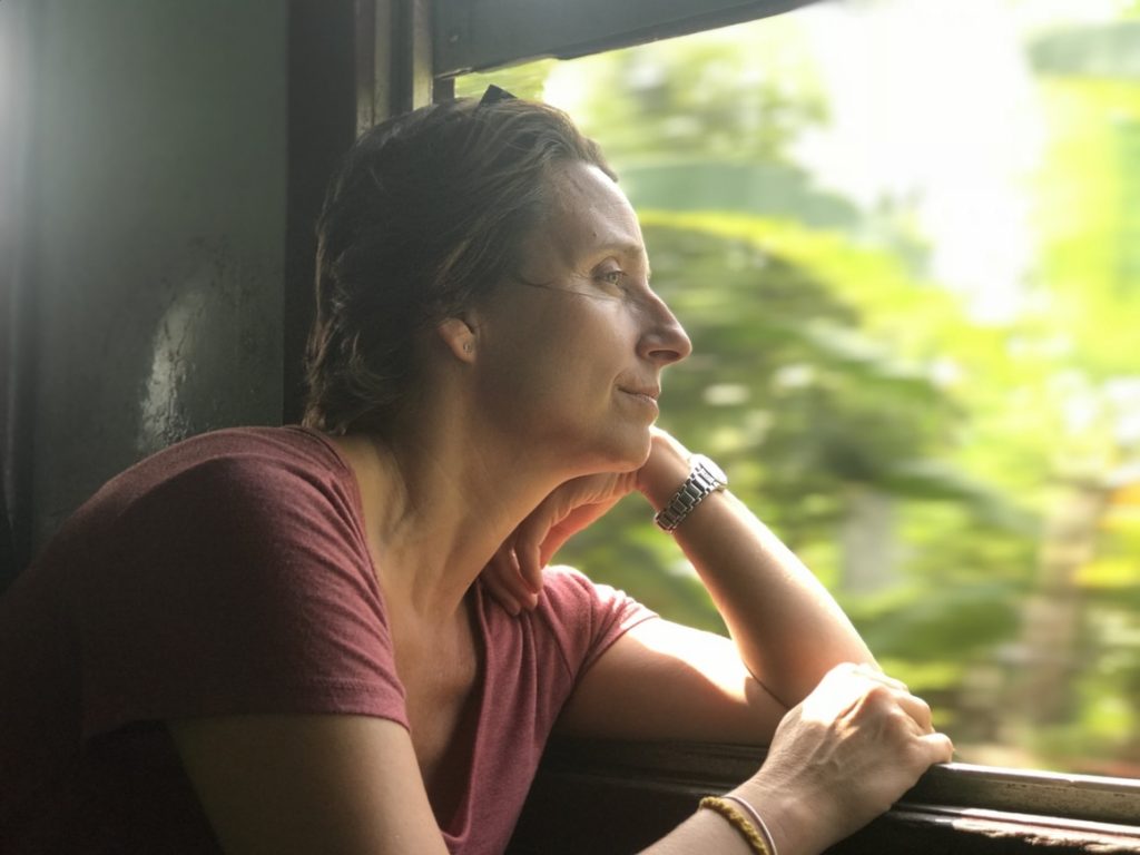 A woman staring out of a train window