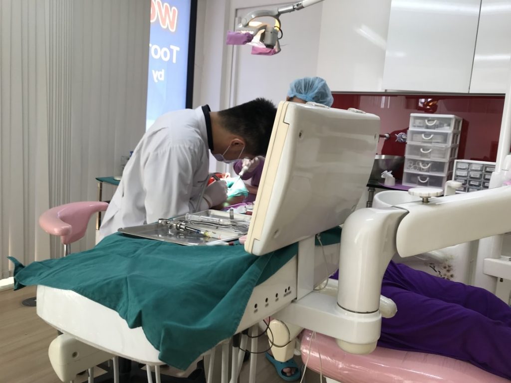 A woman having dental work done in Thailand.