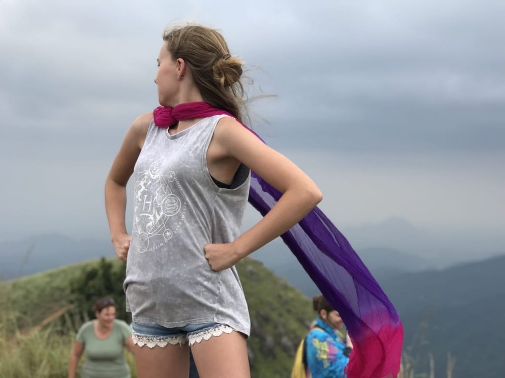 Girl on top of a cliff being brave. Starting soemething new needs courage