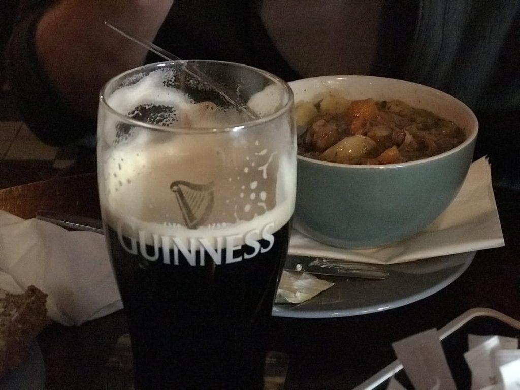 A pint of Irish Guiness and a bowl of stew. Ireland tips for the frist time travel to Ireland