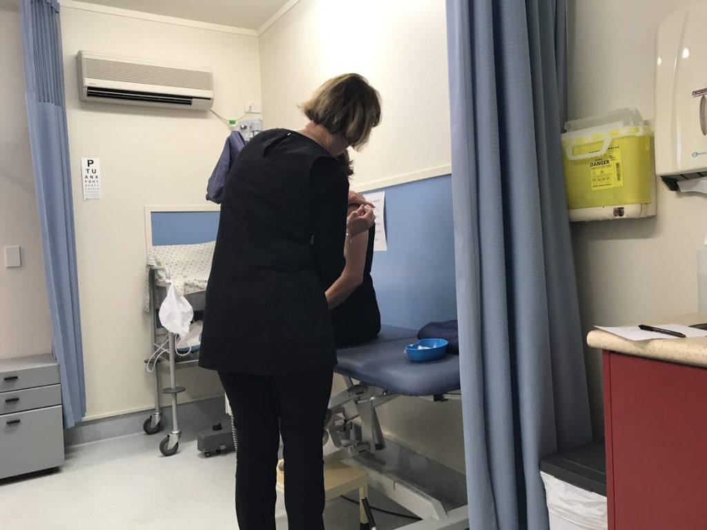Woman having travel vaccinations. Travel checklist. 30 things you must remember to do