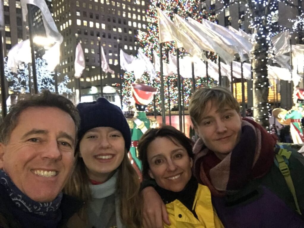 Family at the Rockefellar Centre in NYC at Christmas