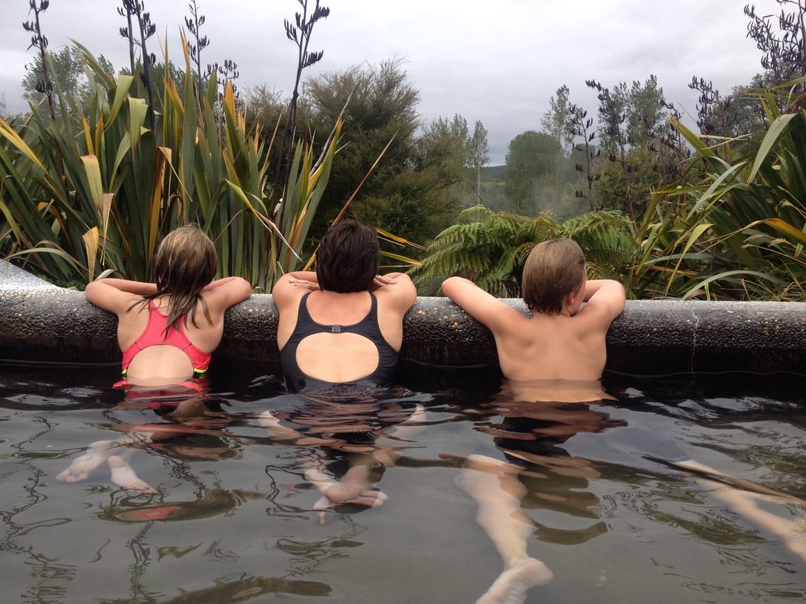 Family in hot springs in New Zealand