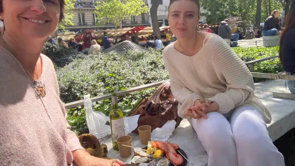 A girl eating a picnic in paris