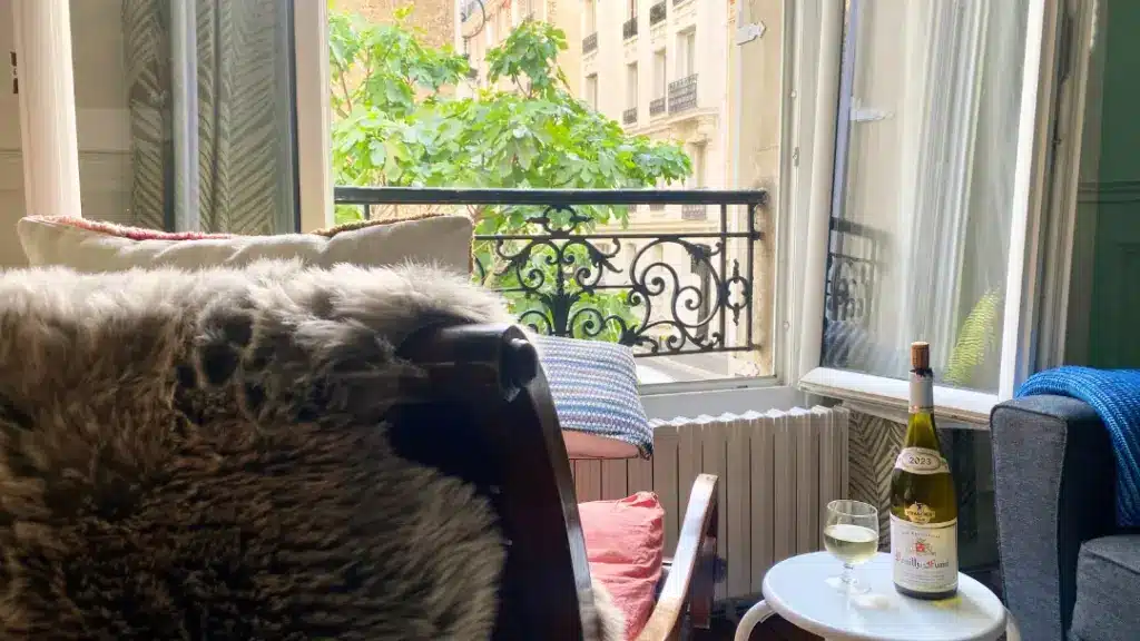 A chair by a window in Paris. One day in Paris