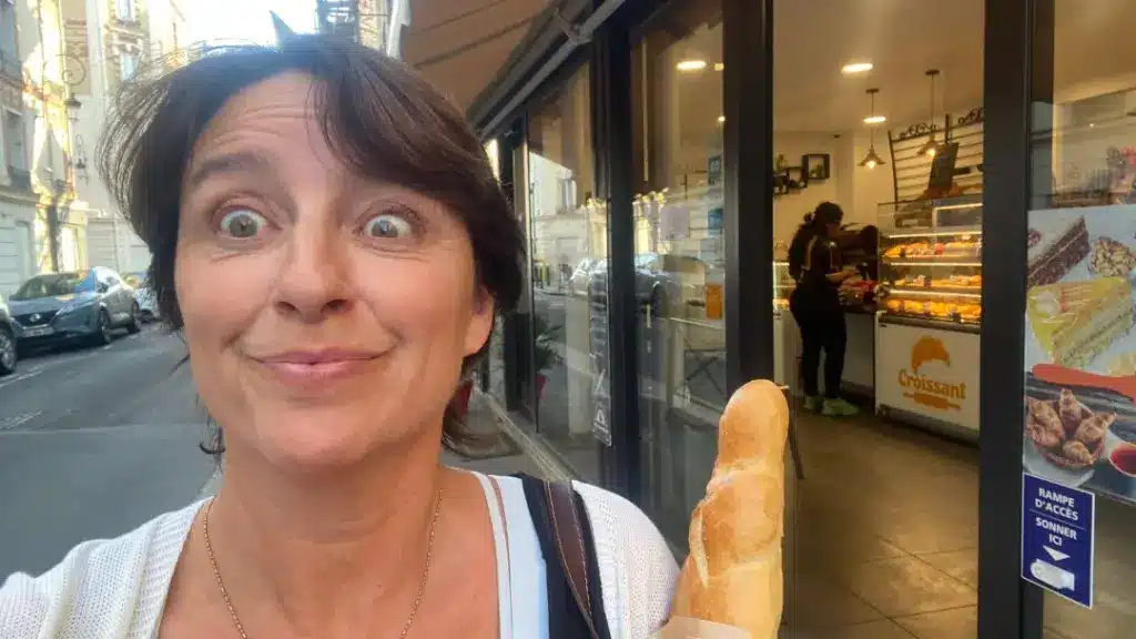 Woman in Paris holding a baguette