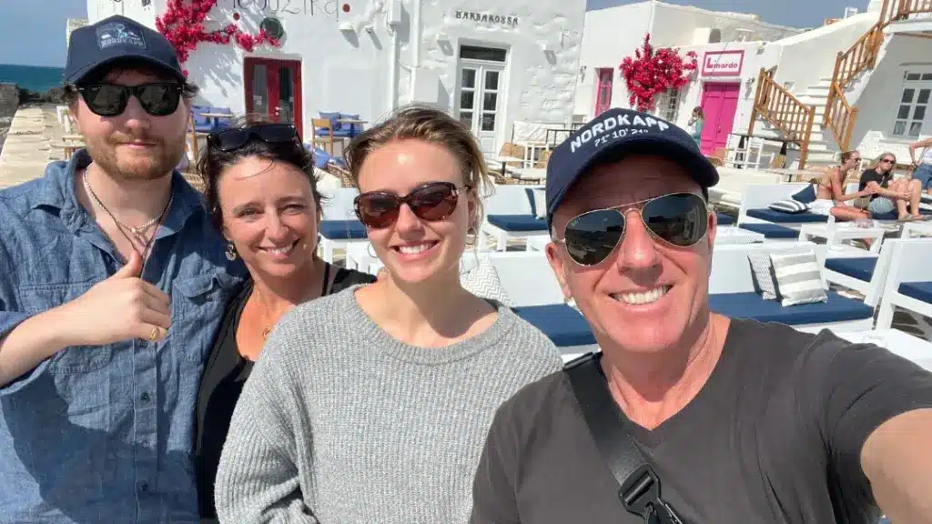 A husband and wife recording a podcast from Naousa, on the Greek island of Paros about travel in Greece.