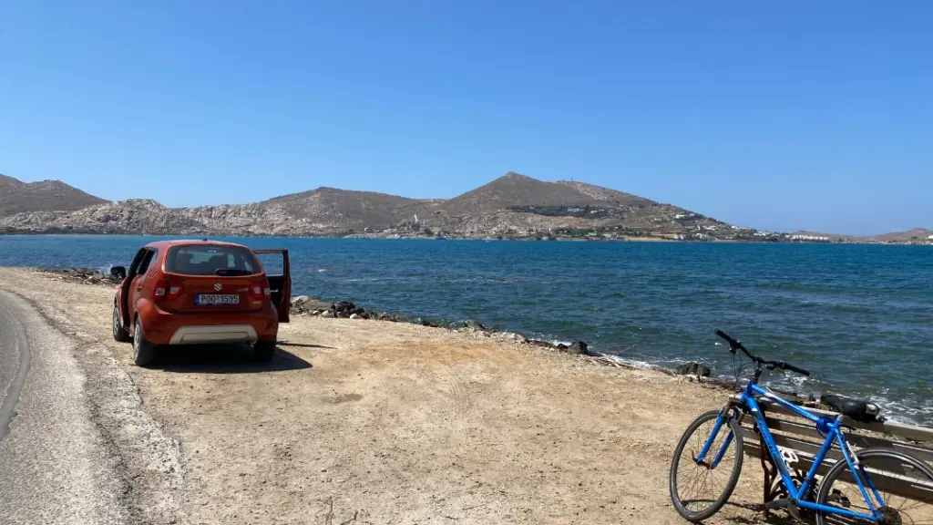 A car parked beside the seashore in Naousa, Paris, Greece. A husband and wife sitting in a car with the door opened, recording a podcast about life changes and how they are navigating the next stage in life. They also discuss why we struggle to see ourselves as others see us. If you enjoyed this podcast, please subscribe on your favourite app and don;t forget to follow Liz and Brian as they take you on their year long adventure to discover what it is we all want next from life