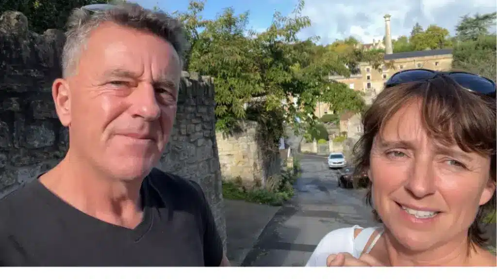 A happy married couple talking about letting it go on their podcast