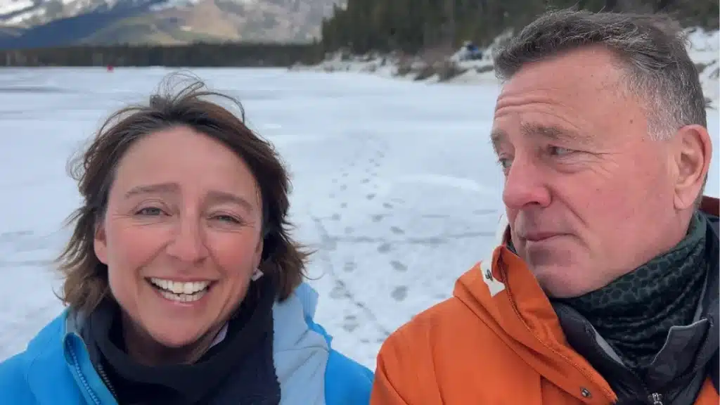 A married couple in Canada BC walking on a frozen lake talking about a recent encounter i Canada on the It's a Drama podcast