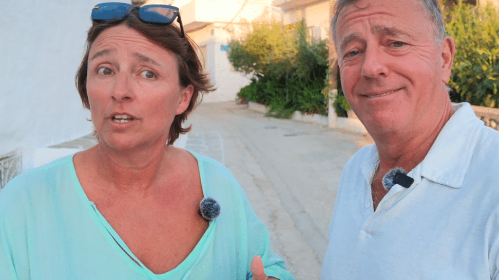 A man and woman, husband and wife in Paros, Greece talking on there podcast it's a drama, about the way Greek people behave and why they love them for it!