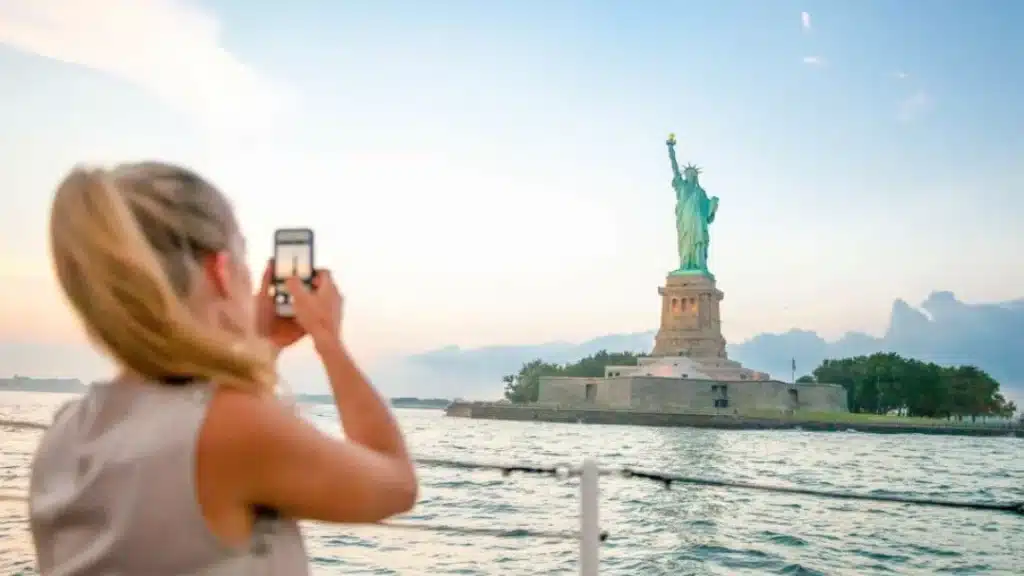 Taking a photo of the Statue of Liberty in NYC