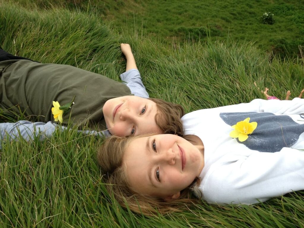 Two children in the grass