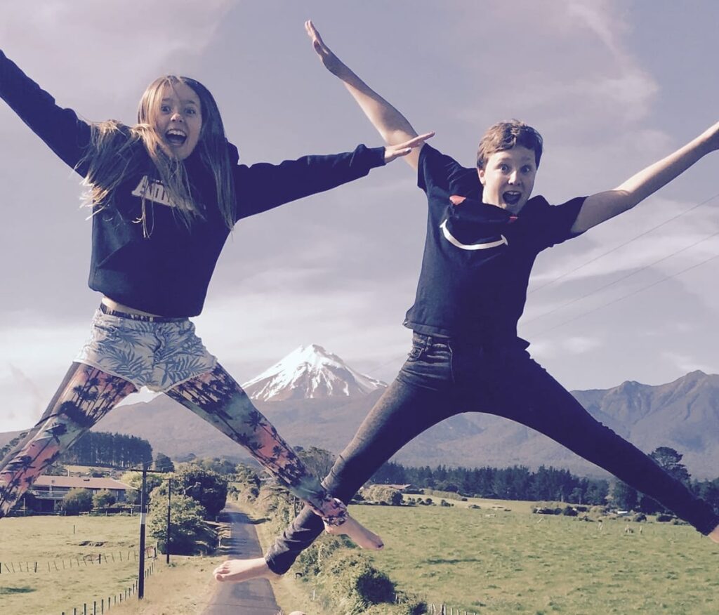 Two children bouncing on the trampoline. Homeschooling how to start.