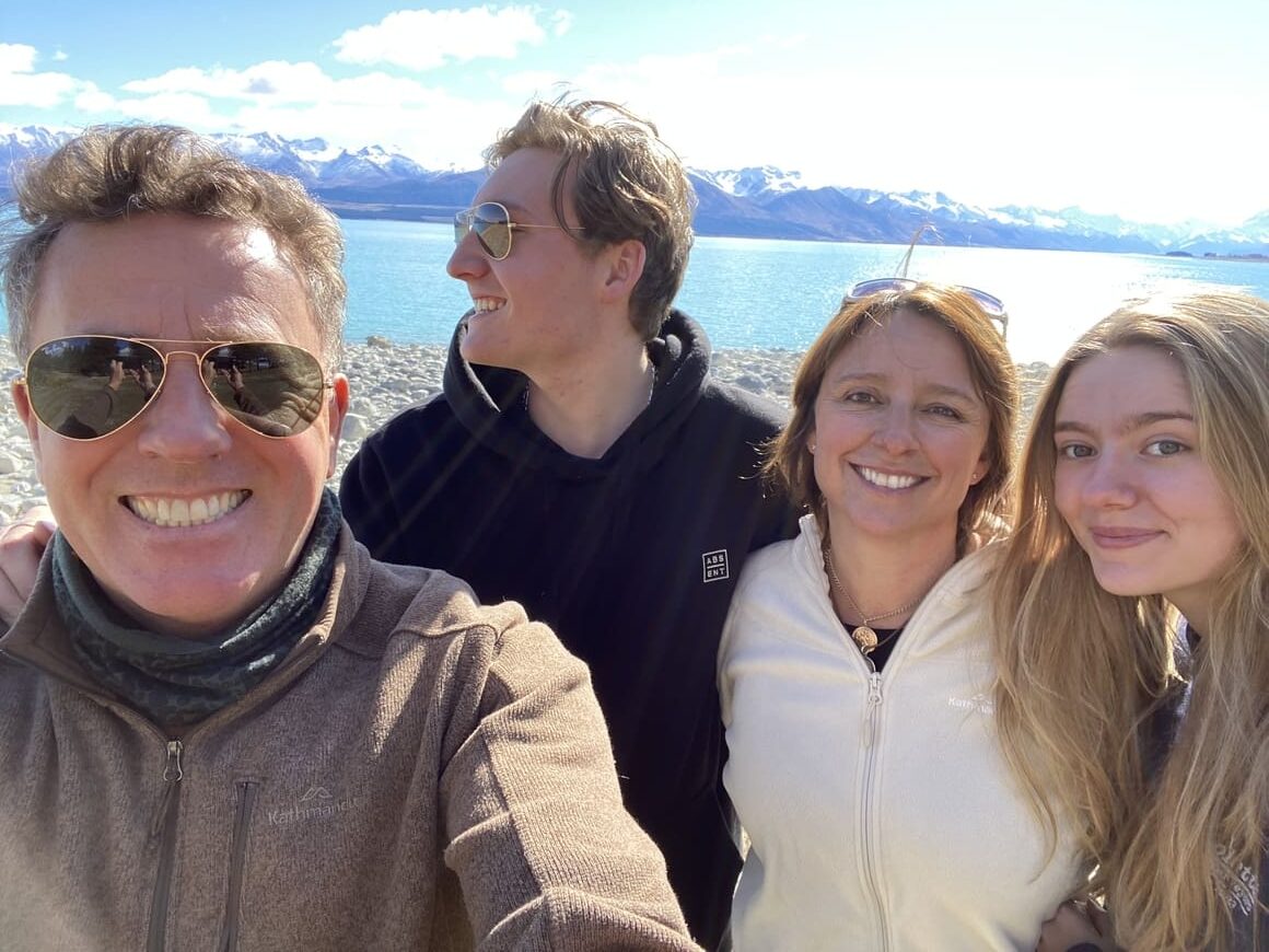 Family smiling in New Zealand