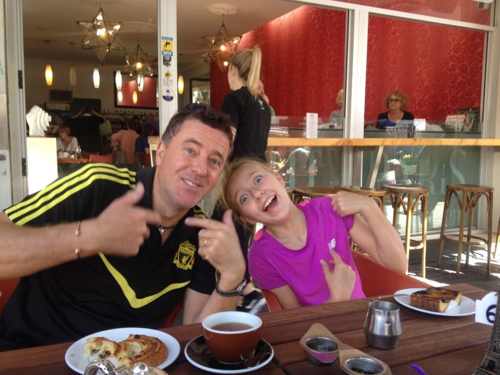 Father and daughter at a cafe in New Zealand