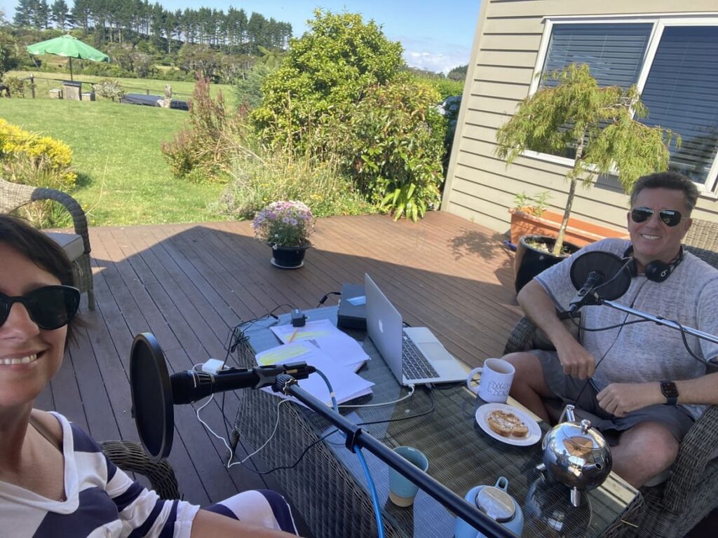 A husband and wife making a podcast episode in New Zealand