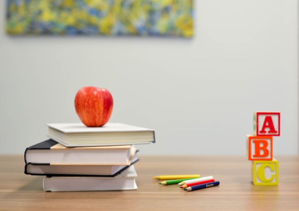 Book and an apple. Tips on home to start homeschooling