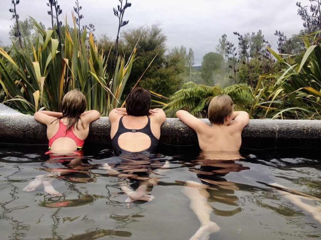 Family in a hot pool in new Zealand