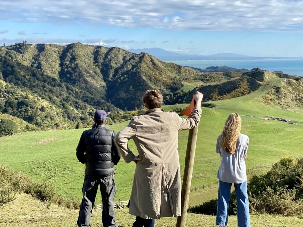 Family overlooking the hills in New Zealand 