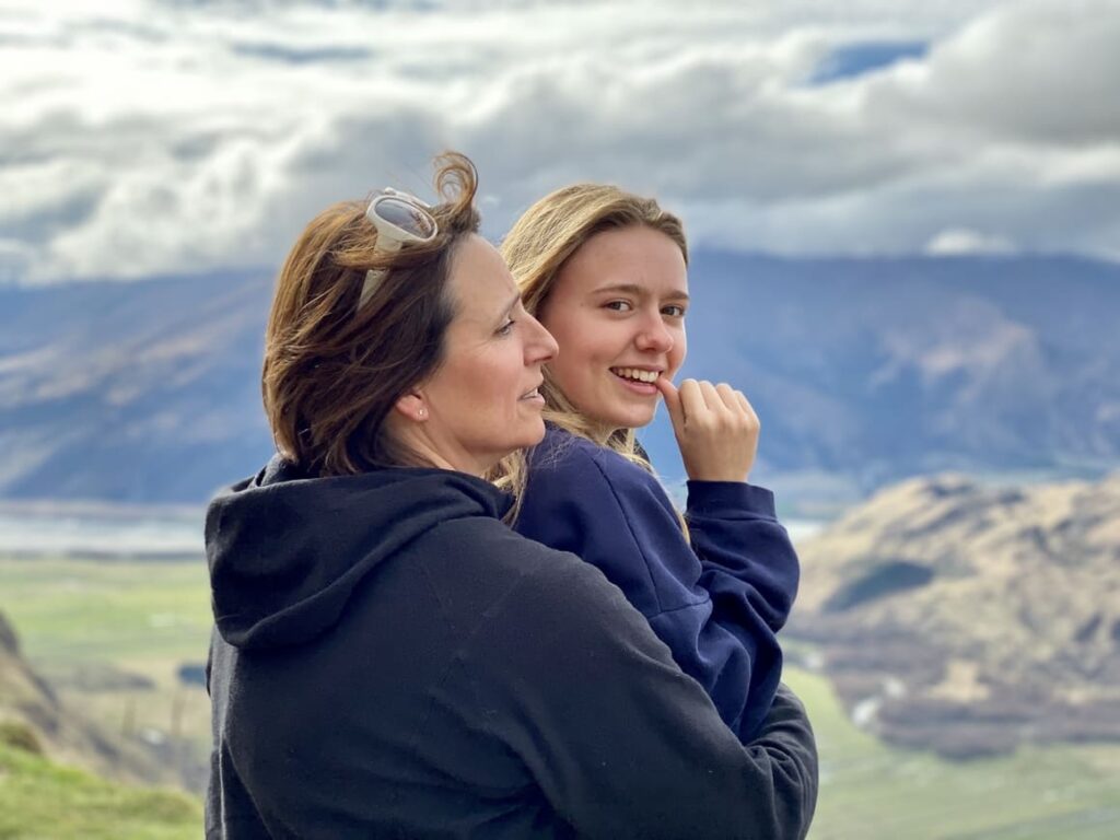 Mother and daughter standing looking at the view in New Zealand 