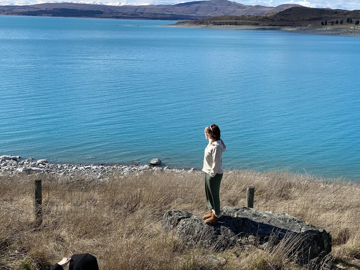 Woman standing at Lake in New Zealand