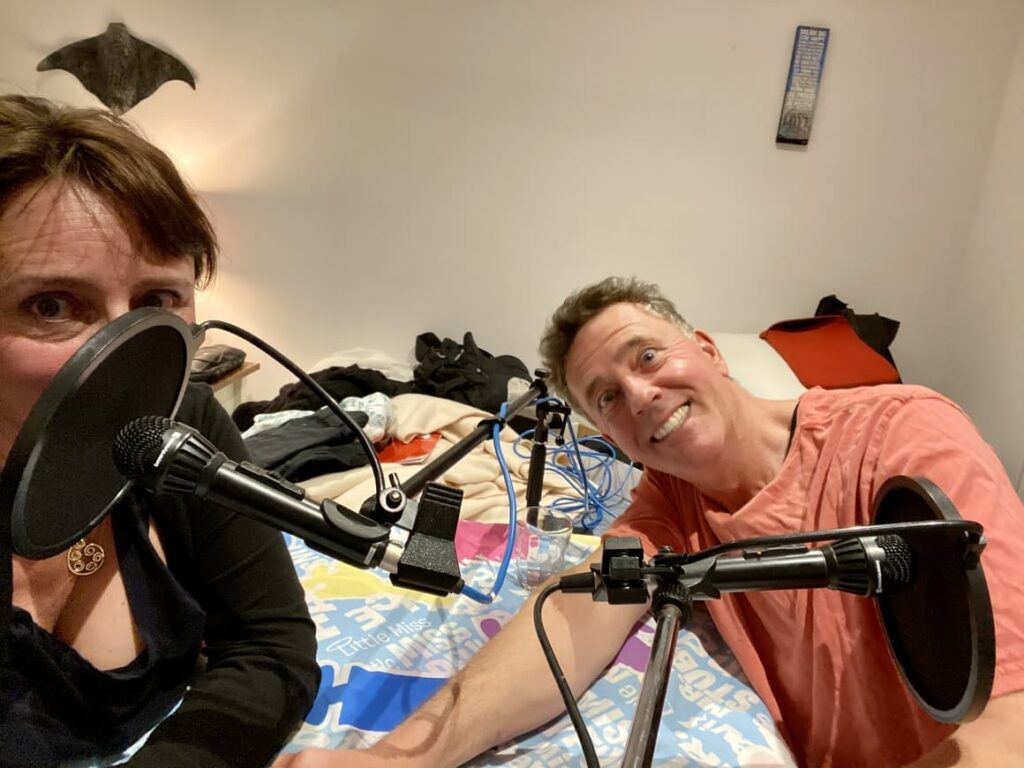 Husband and wife making a podcast episode together