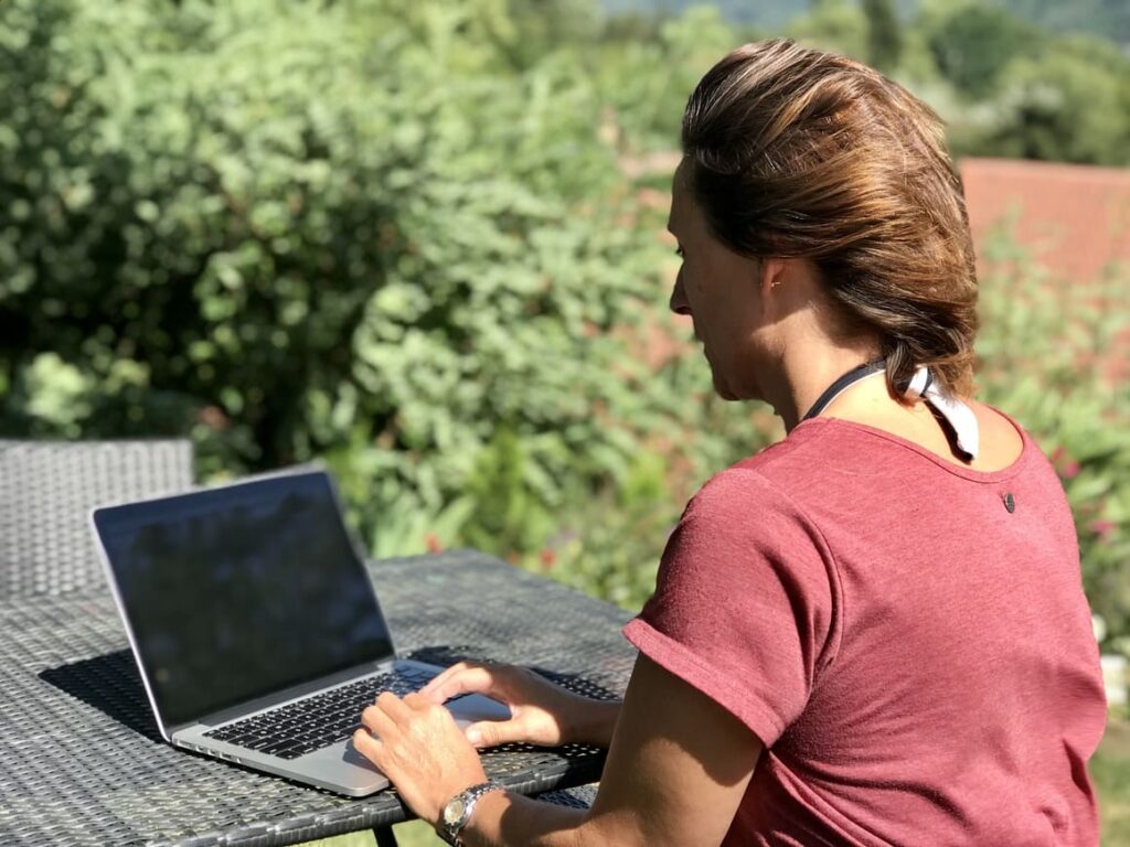 Woman working on her work at home on a computer