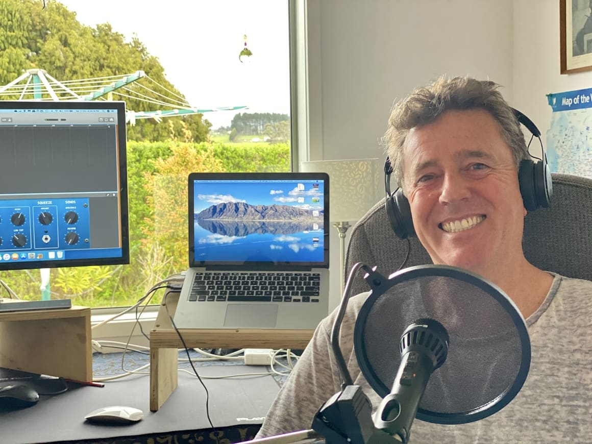 Man sitting in front of his podcast things.