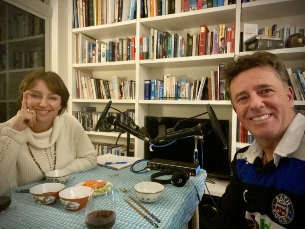 Man and wife talking on their new Zealand podcast