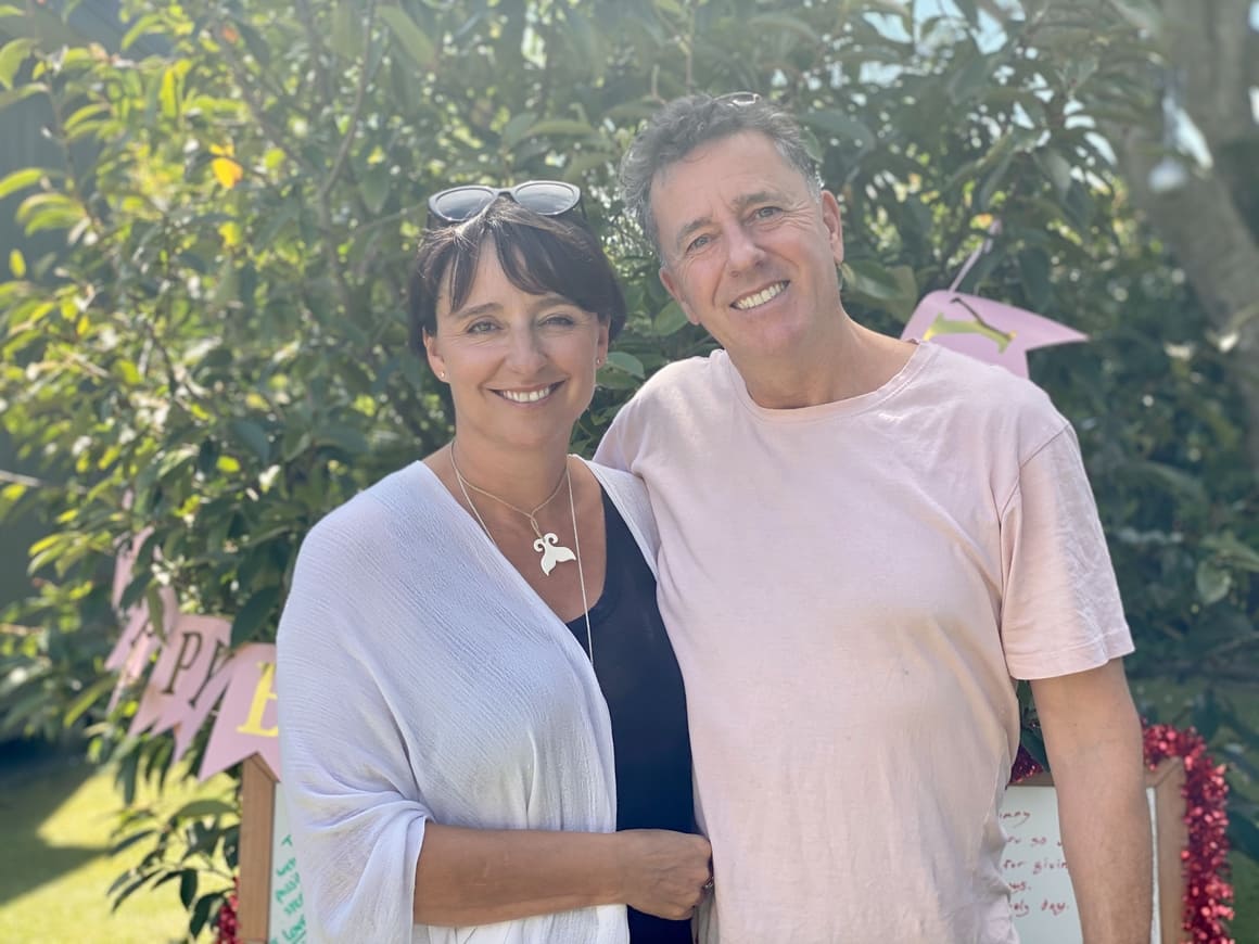 husband and wife in a garden in nEw Zealand