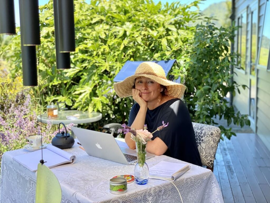 Woman in New Zealand. Writing a book