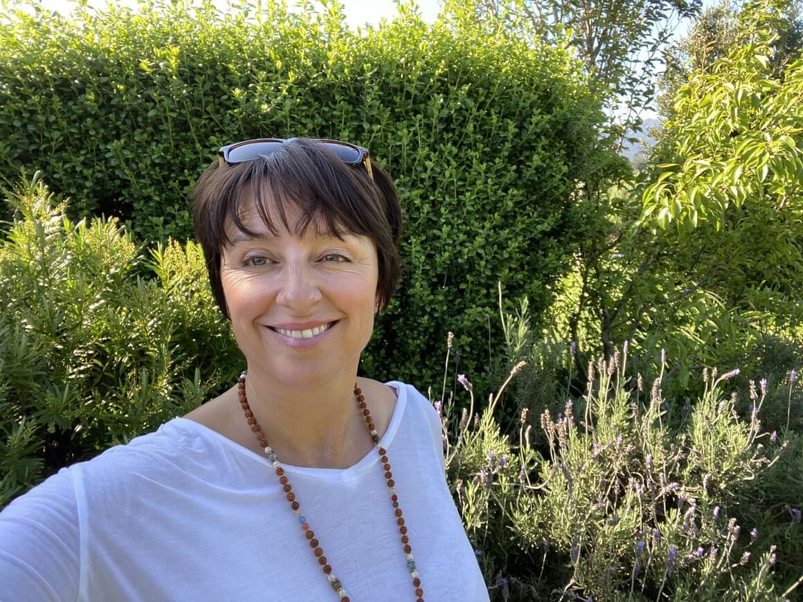 Woman smiling at the camera in New Zealand. 